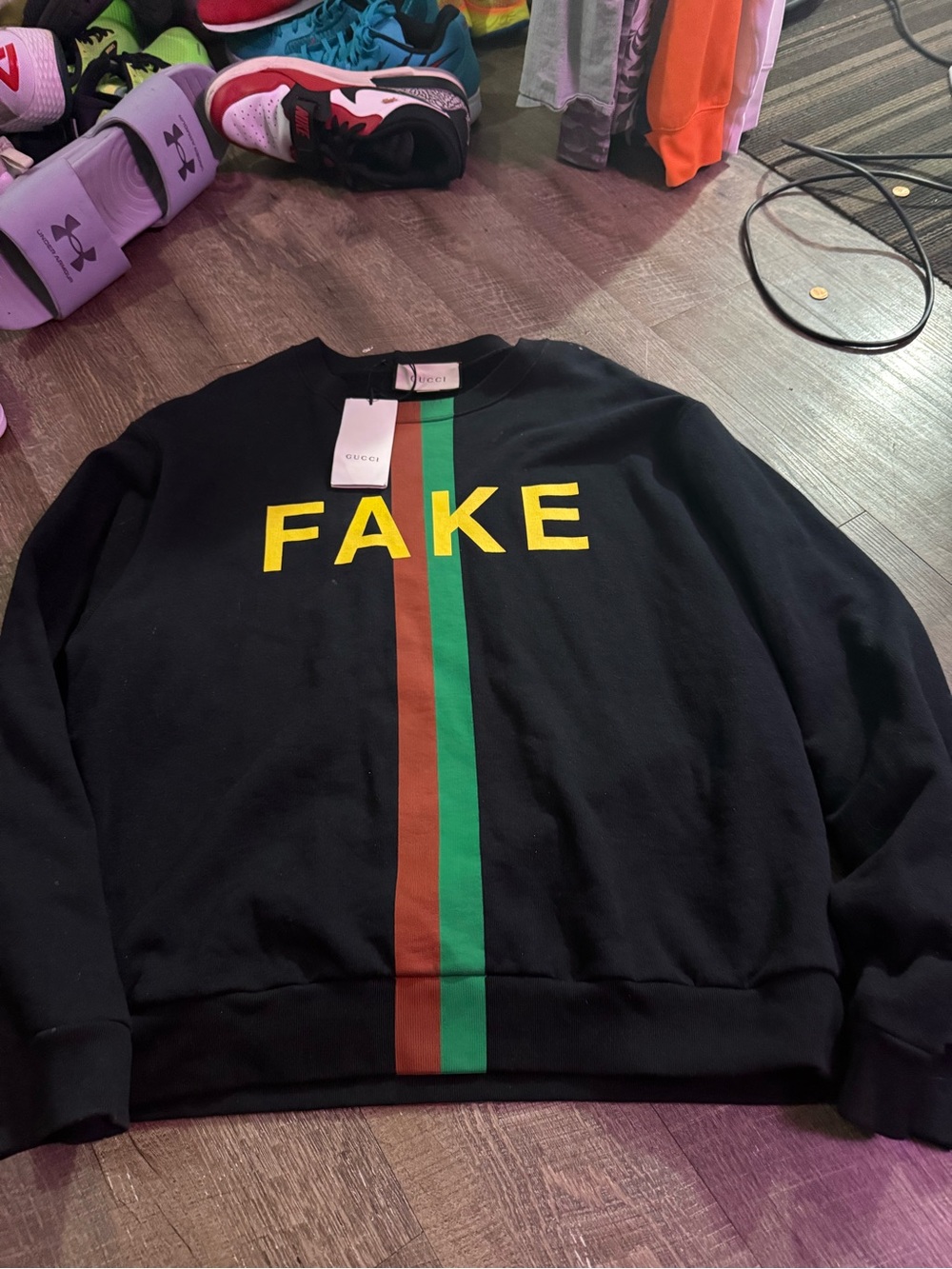 Gucci Black Crewneck Sweater with Yellow FAKE Text and Green & Brown Stripe. NWT